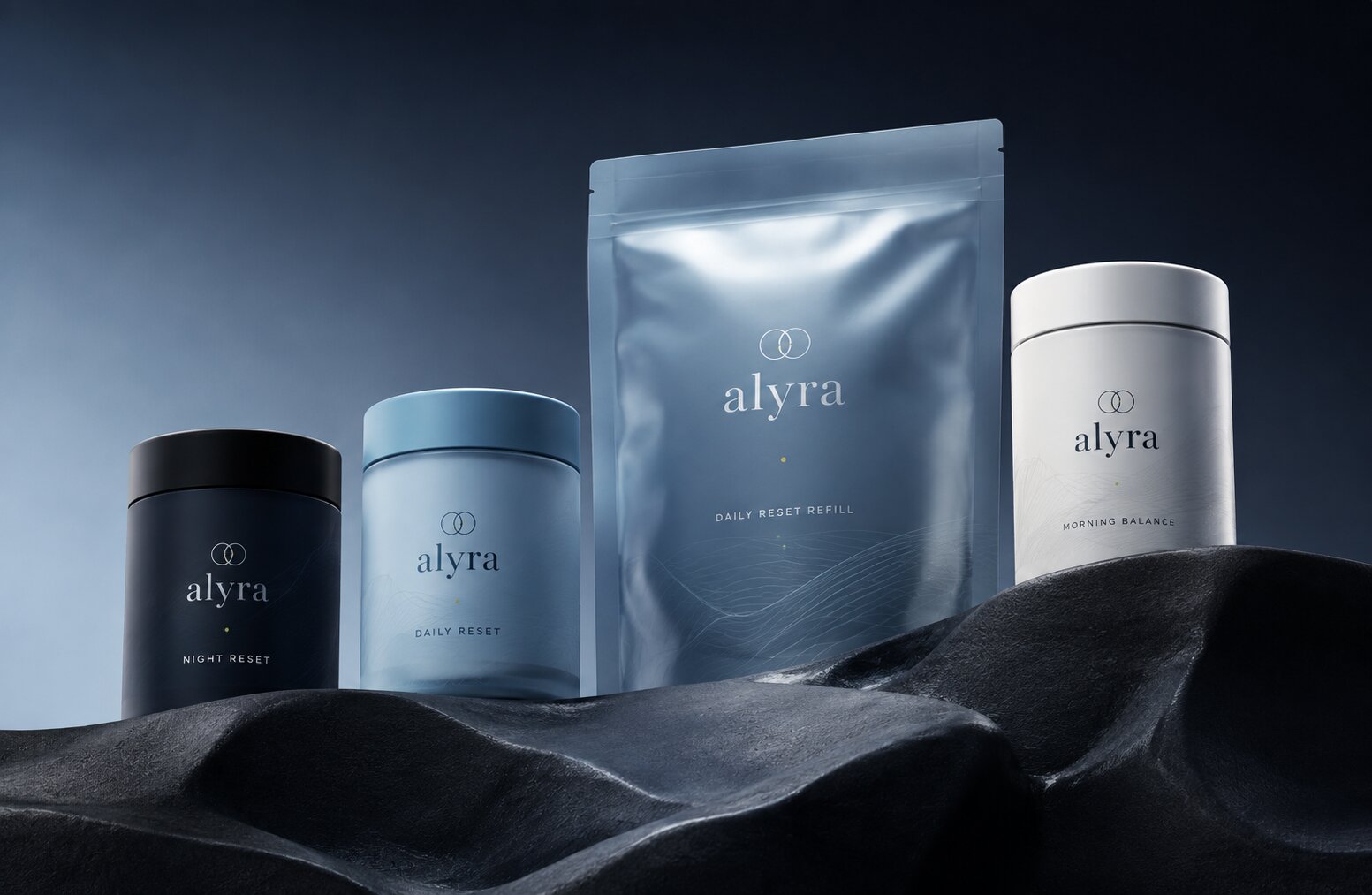 Alyra core product range: Night Reset, Daily Reset, refill pouch, and Morning Balance